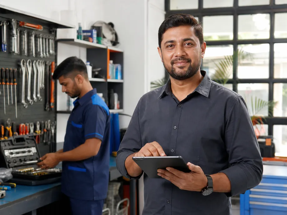 Indian home-services owner reviewing a customer booking